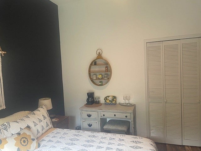 View of bed, one of night stands,  desk, and closet for a general idea of the layout. 