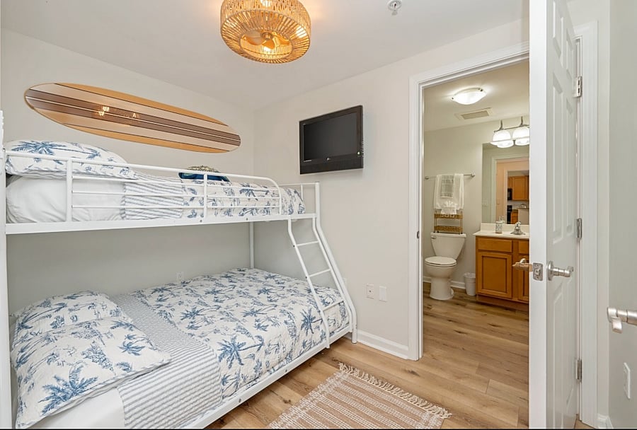 The second bedroom actually has new upgraded bunk bed (not pictured) with TWO Full Size Double beds. There is also an en suite with a WALK IN shower & full bathroom attached. Roku Smart TV in this room as well.
