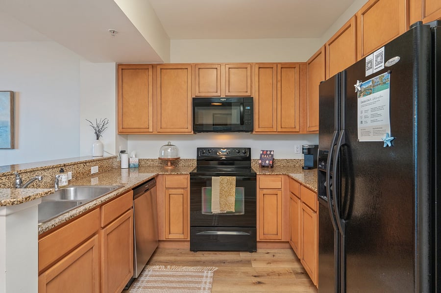 Full stocked kitchen with full size fridge, dishwasher & microwave. two Keurig machines, dinnerware, pots, pans, serving & cooking utensils, cutting boards, glasses, mugs, cutlery, can openers & more!