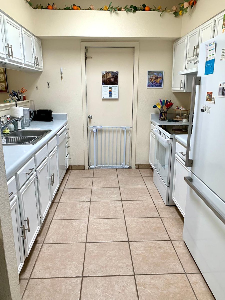 Kitchen and garage entrance with pet gate