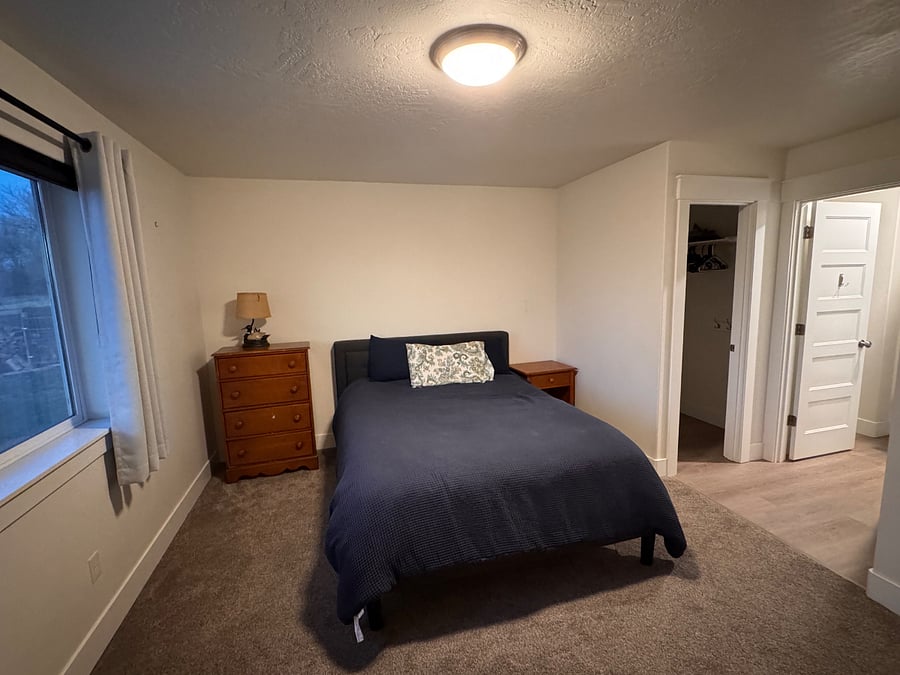 Bedroom 2 queen bed with shared bathroom, walk in closet and sink vanity 