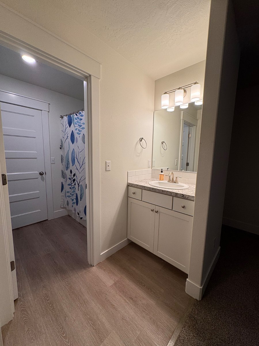 Vanities in bedrooms 2&3 with door to bathroom. 
