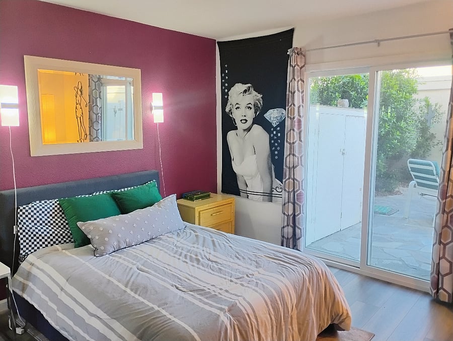 This bedroom is colorful and comfortable.