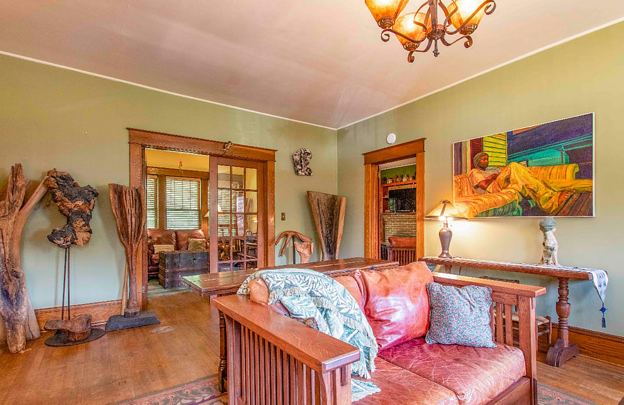 A large living area with French doors to a sitting area / Office