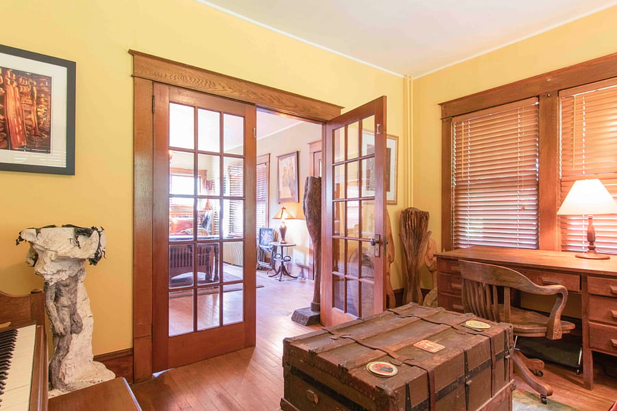 Lovely French doors to the Sitting/ Office area with Piano and guitars