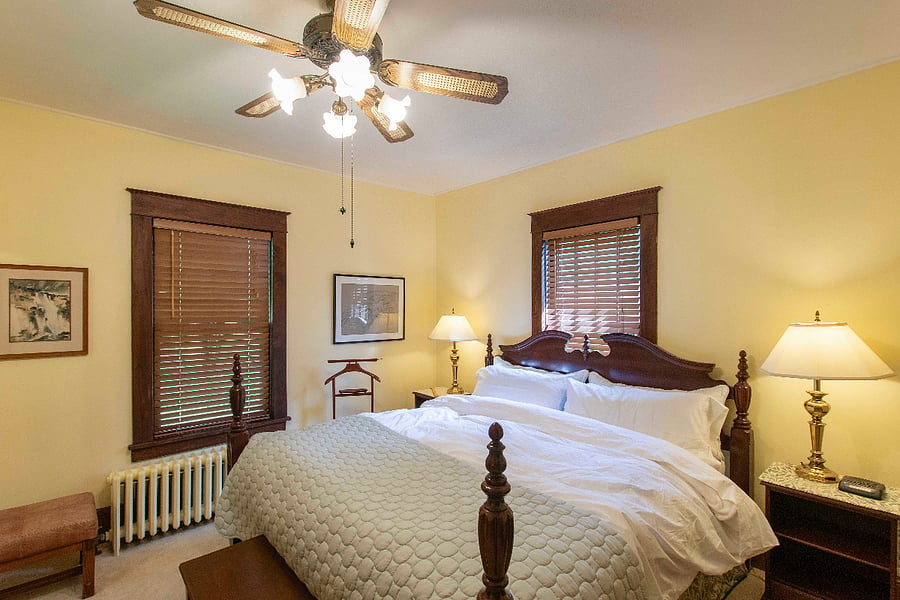 The downstairs bedroom has a comfy king bed, two dressers and two closets.