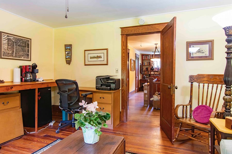 This is the upstairs sitting room with Smart TV, office desk, printer, mini-fridge and coffee maker