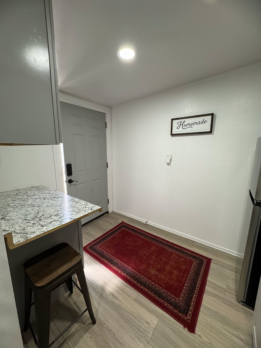 Front door and kitchen area