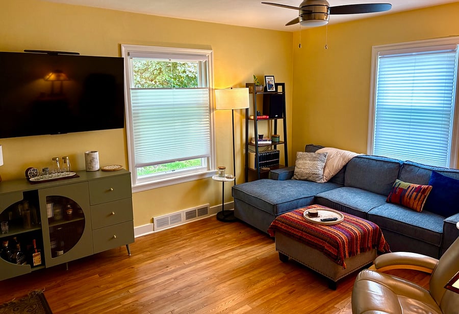 Living Space with large screen TV and sleeper sofa. Hardwood floors refinished here and in both bedrooms. 