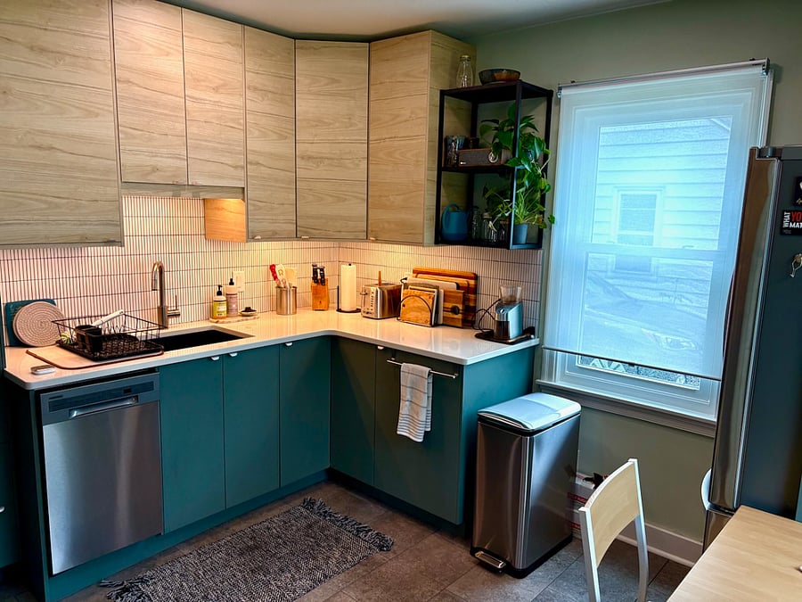 Kitchen has quartz countertops and modern cabinets