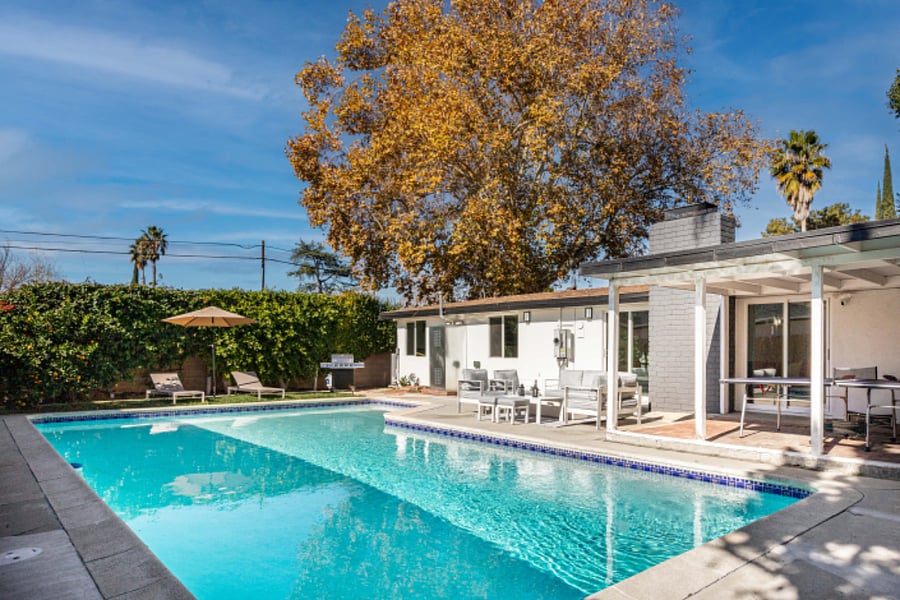 Spacious backyard with private pool and patio seating