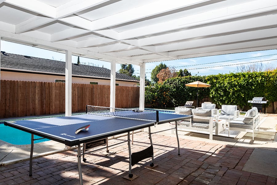 Outdoor game area with ping pong table for entertainment