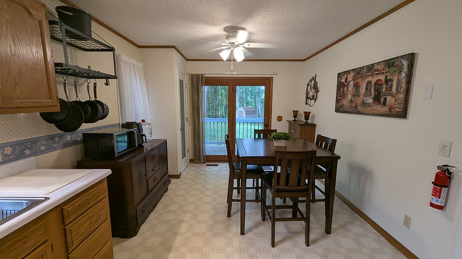 Step right out of the kitchen onto a charming private deck perfect for morning coffee, herb gardening, or a quiet moment in the fresh mountain air.