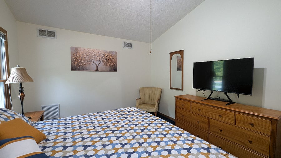 Rest easy in a quiet, private bedroom area with cozy furnishings and a tranquil atmosphere and large Roku TV