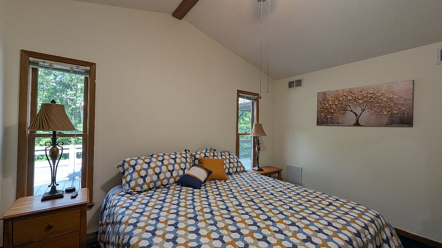 Rest easy in a quiet, private bedroom area with cozy furnishings and a tranquil atmosphere.