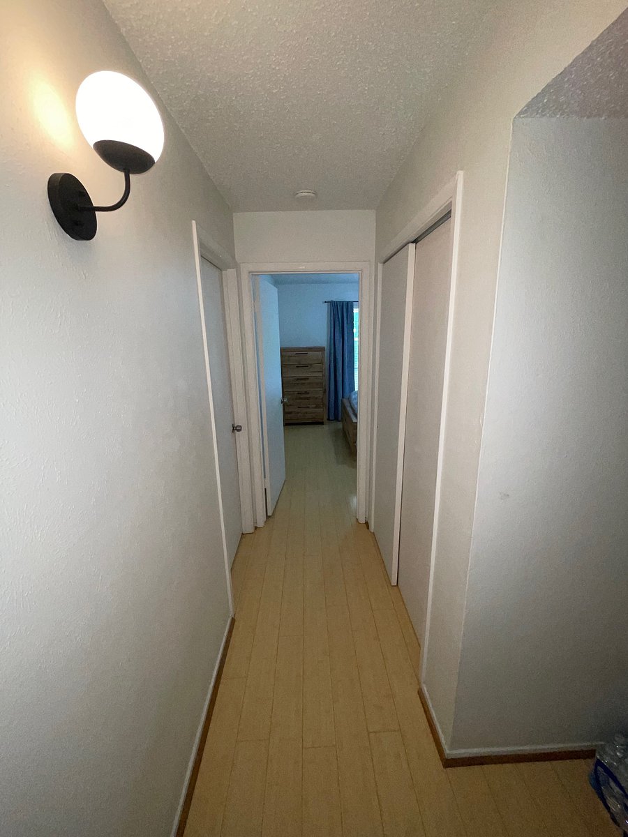 Bedroom down hallway from bathroom.