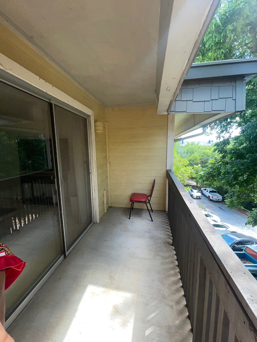 Patio outdoor light on the side of the screen door.