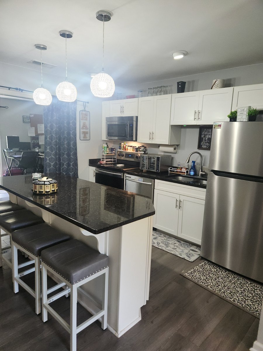 Updated kitchen with stainless steel appliances and granite counter tops. Stocked with all you need to heat food up on the run or cook a holiday meal. Open to livingroom and bonus room/additional sitting area.