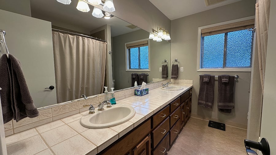 Bathroom - two sinks - tub/shower.