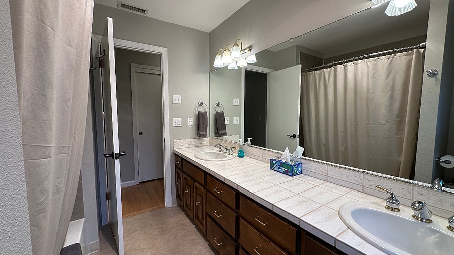 Bathroom - two sinks - tub/shower.