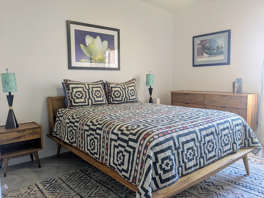 Guest bedroom has very comfortable queen bed, southwestern artwork, and 2 huge closets.