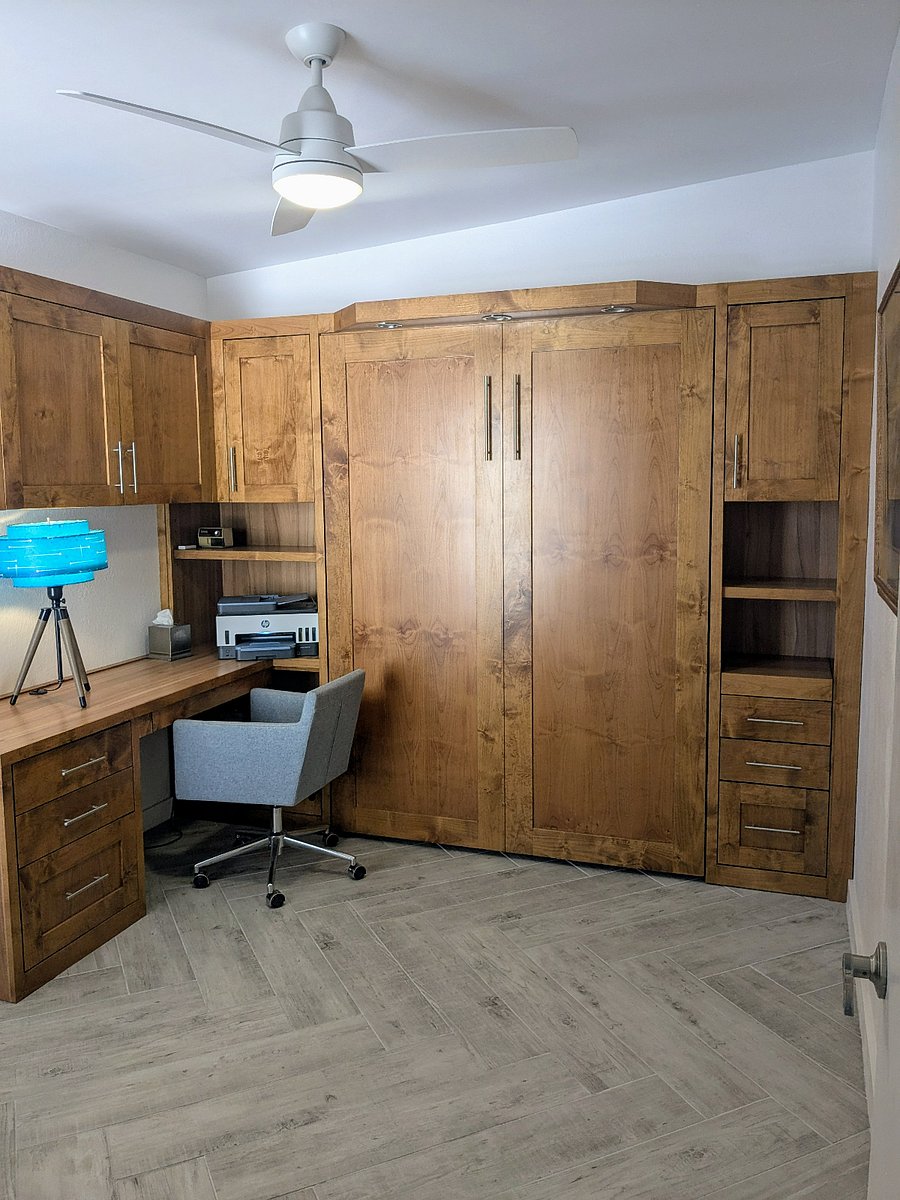 Custom built office includes printer, monitor, comfortable chair, and storage. Queen size murphy bed pulls down (see next photo).