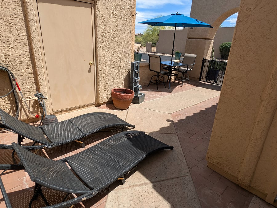 Front patio is spacious with nice views. There are extra chairs and folding chaise lounges in the closet. Soothing fountain adds to your relaxation.