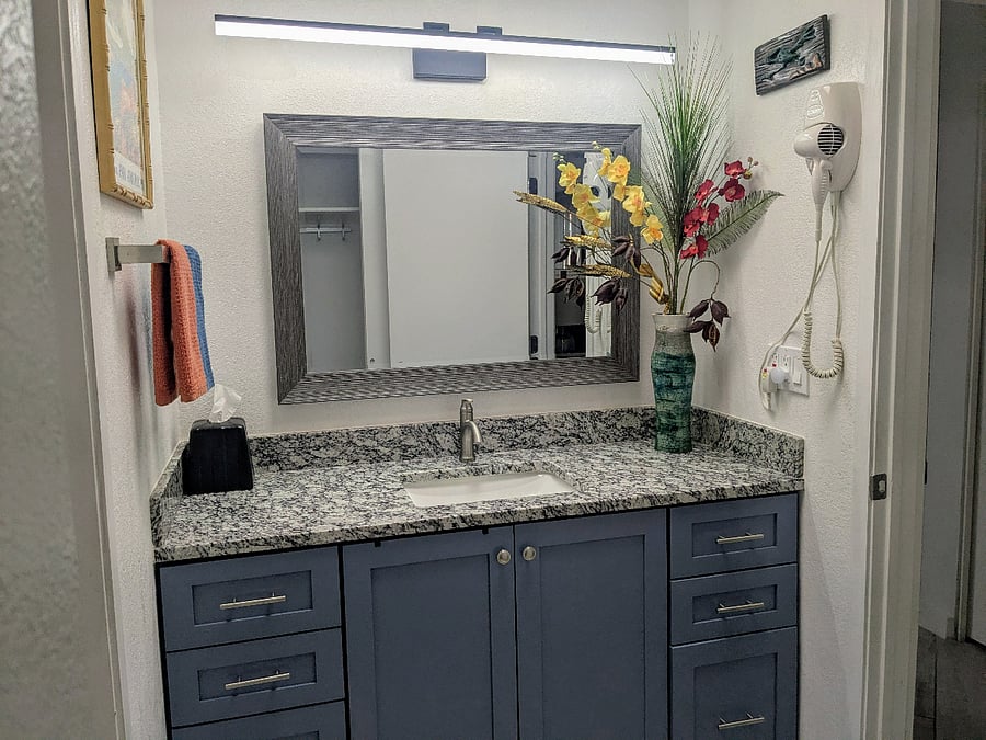 Main bathroom sink area. Also includes ample storage space for linens and more.