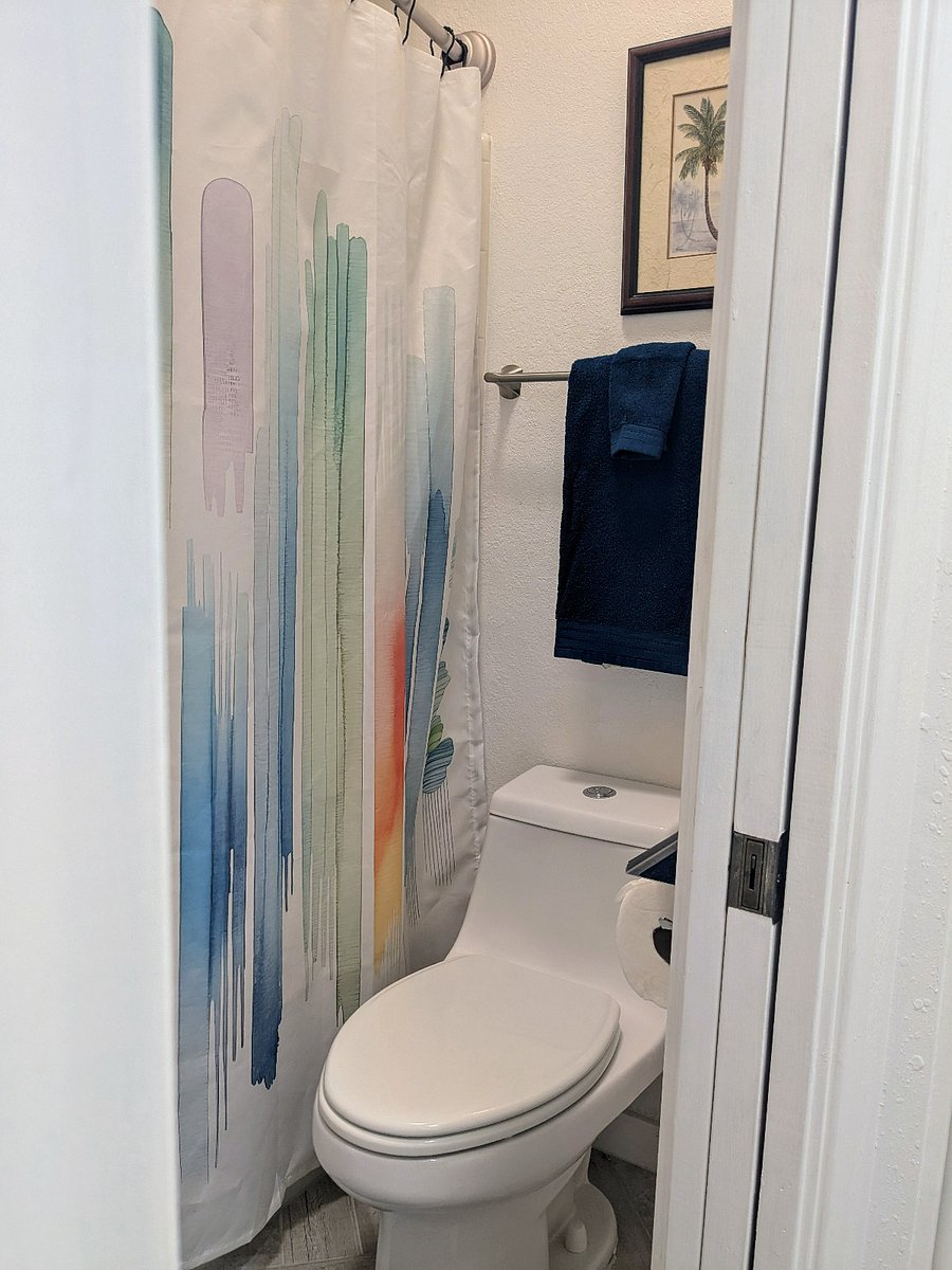 Guest bath has tub/shower combo.