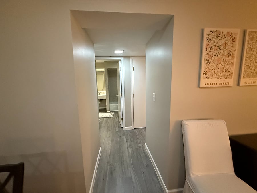 Hallway from kitchen / dining area down to bathroom.