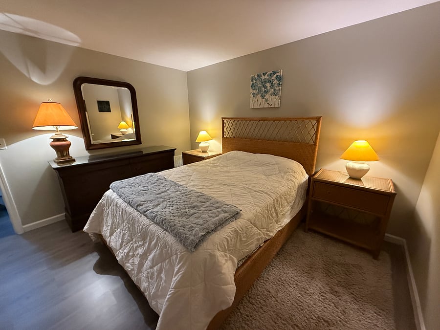Master bedroom with nightstands and dresser.