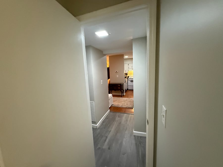 View from bathroom through hallway and into main living area.