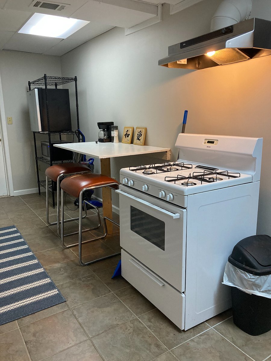 Gas range / oven, microwave, and mini fridge.
