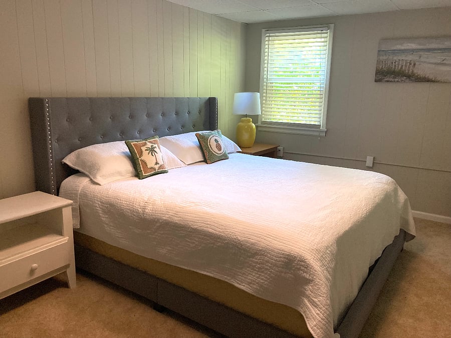Main bedroom with AMAZING King size bed and fresh, comfy linens, pillows, blankets.