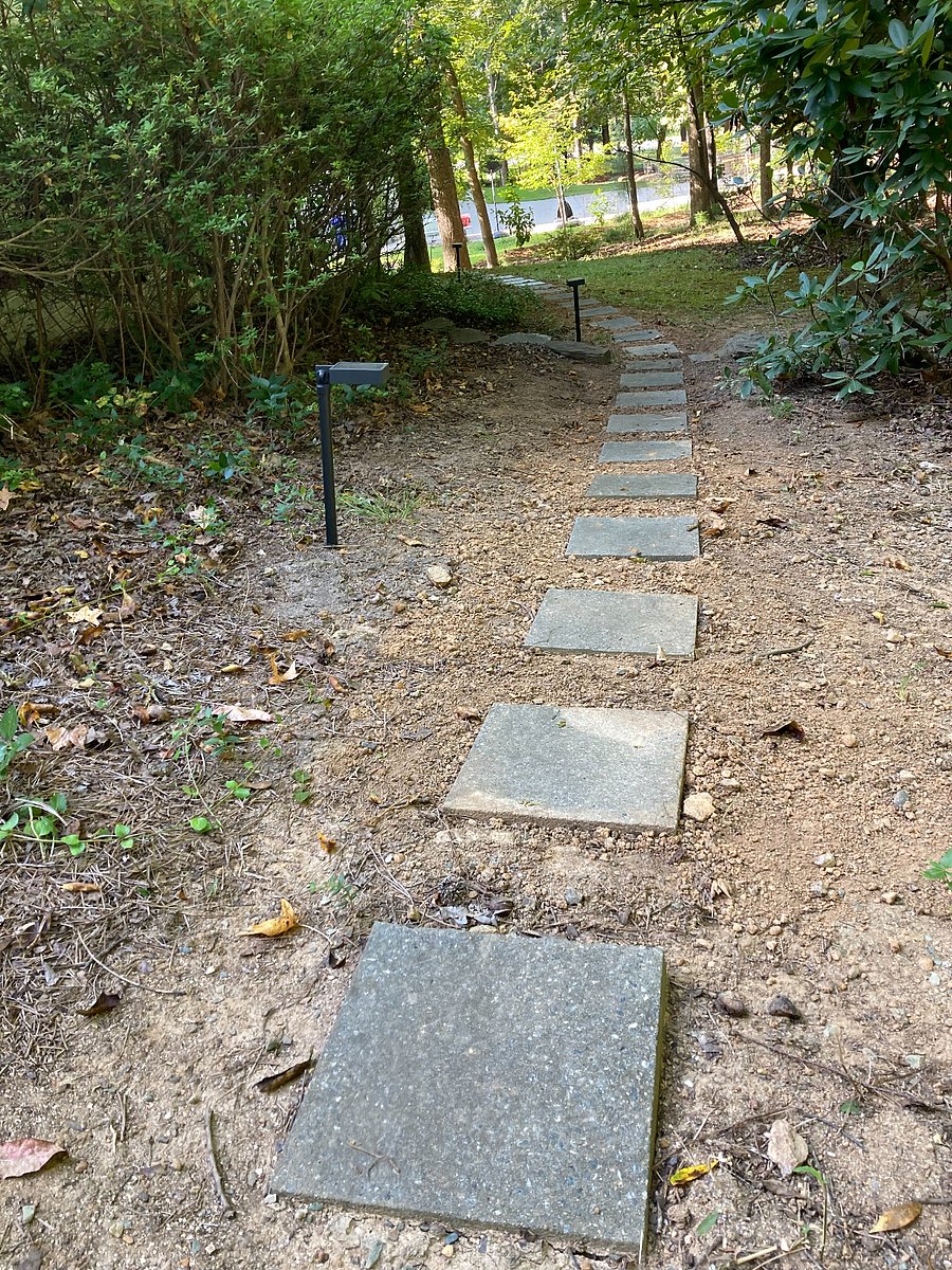 Stepping stones from your designated parking space in driveway lead to the private entrance of apartment. (100 ft. walkway on gentle, sloping incline, no handrail)