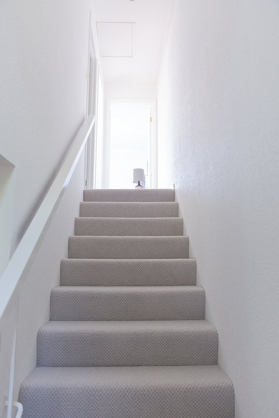 Stairs lead to master on L and 2nd bedroom straight ahead.