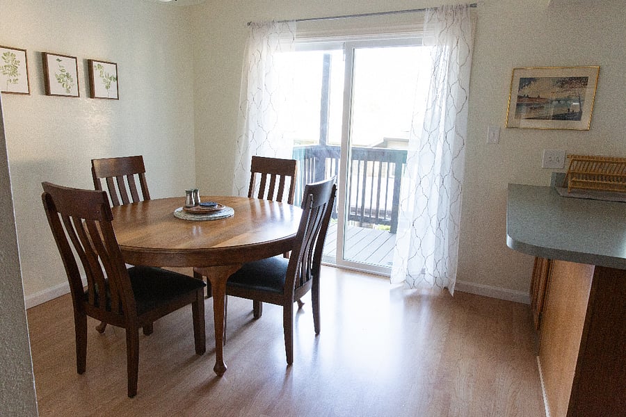 Dining area looks out over patio deck.