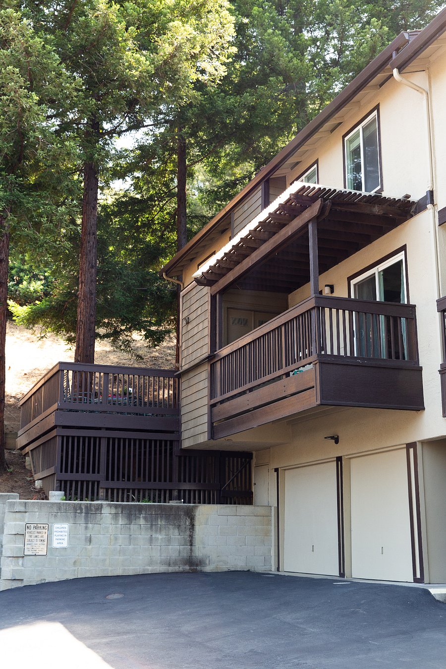 Patio deck off the kitchen with the garage below. Garage holds one car with room for storage.
