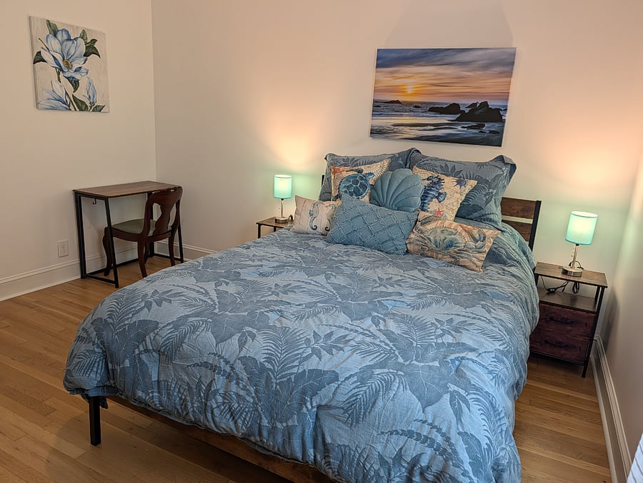 Second bedroom with queen bed and desk.