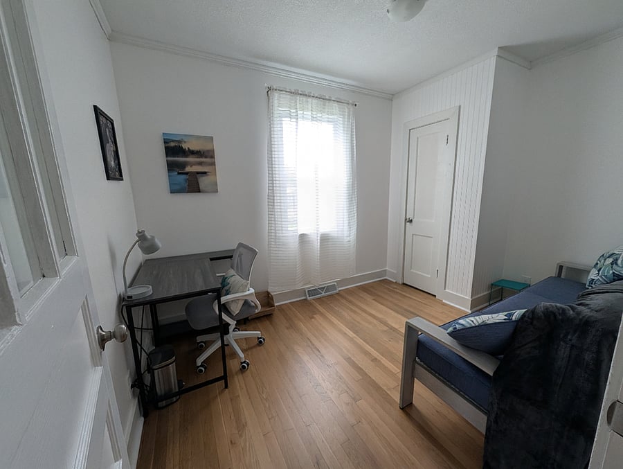 Office with desk and couch.