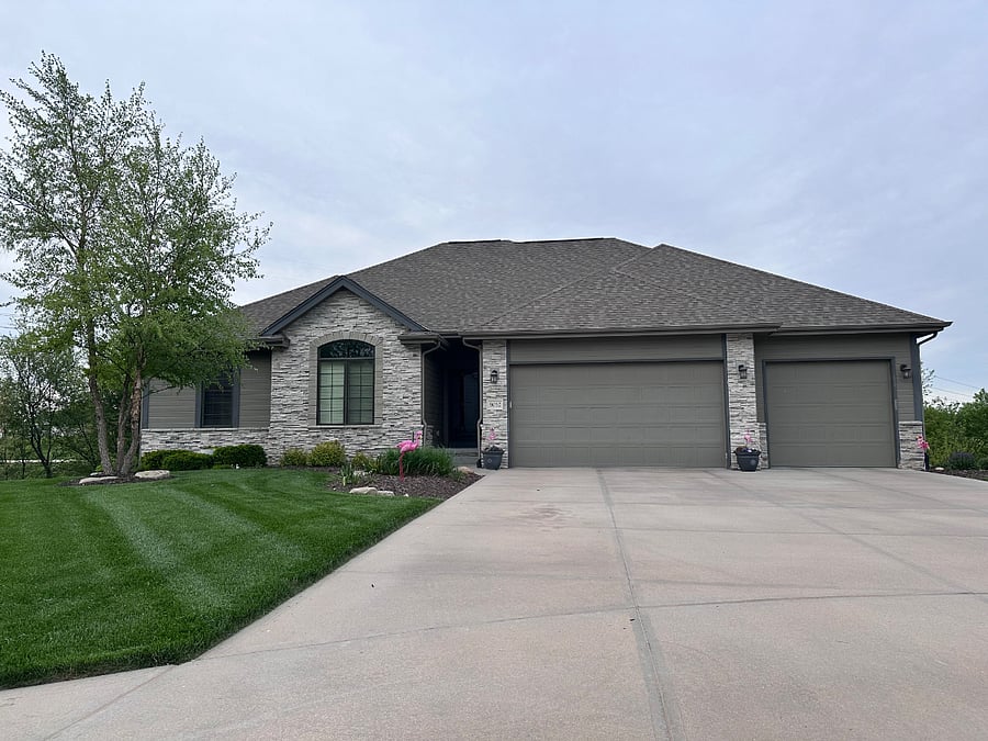 Front of the house. In ground sprinkler system with lawn mowing and snow removal services provided.