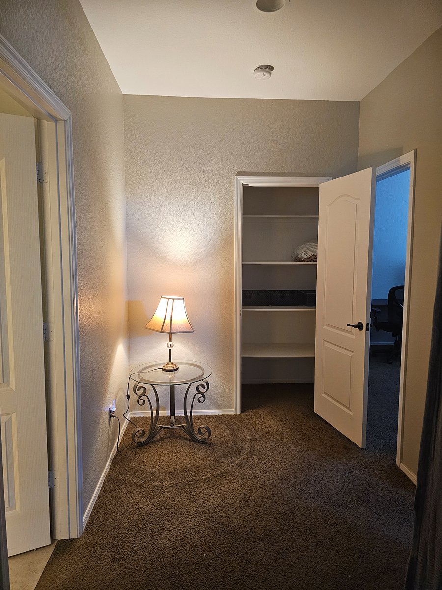 Private hallway linen closet can be used for storing foldable clothing.