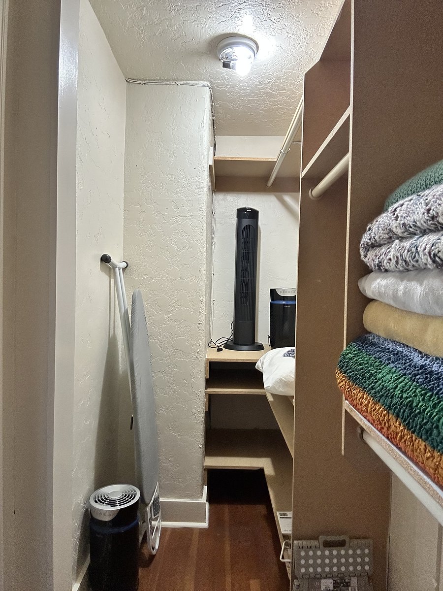 Walk in closet in bedroom