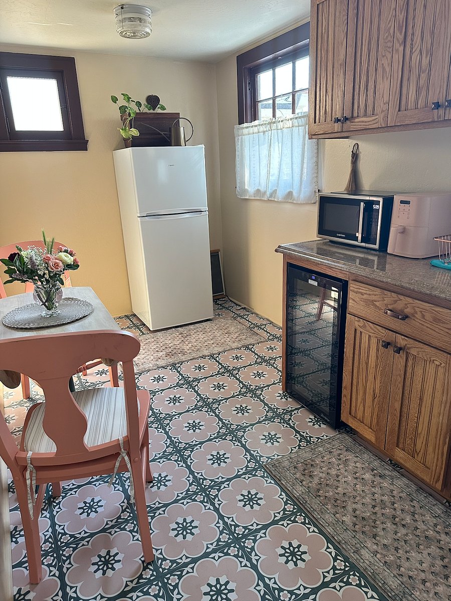 Wine cooler; standard size refrigerator, microwave, air fryer, coffee maker. Dedicated workspace