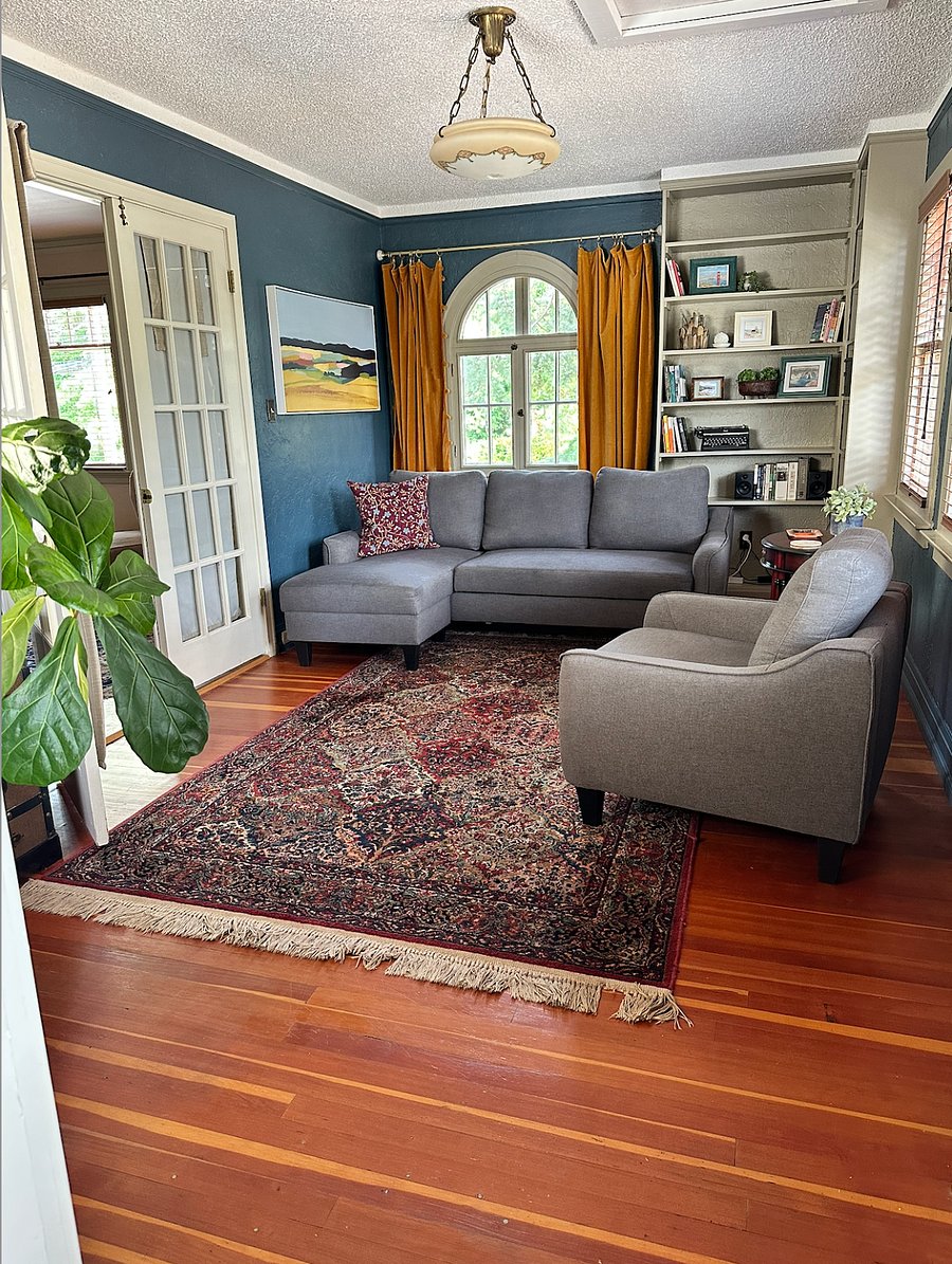 Living Space. French doors lead to bedroom.