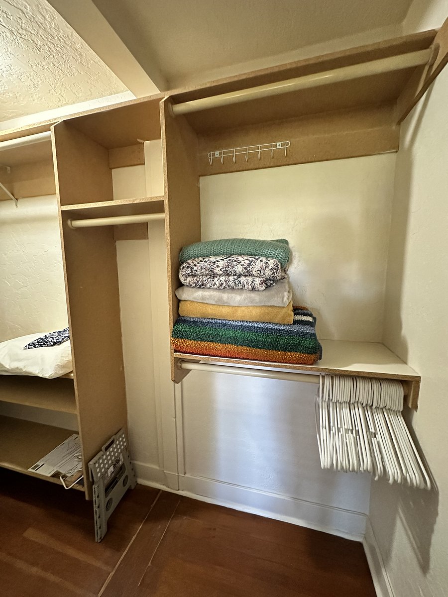 Multiple hanging and shelf spaces in master closet. (Closet door has a full length mirror.)