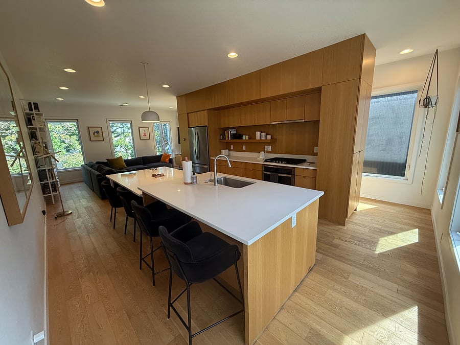 Chefs kitchenquartz waterfall island seats fourInduction range, Bosch DW, stocked spice & knife set
Dining nook ready for sixor laptops on workdays