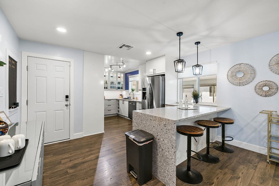 Start your mornings at the breakfast bar or wind down with a glass of winethis kitchen is ready for both.