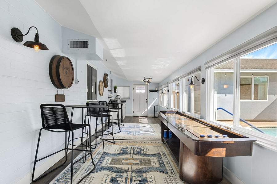Welcome to the Whiskey Barrel Lounge, a laid-back game room with shuffleboard, a poker table, and whiskey-inspired decorperfect for friendly competition or a casual night in.
