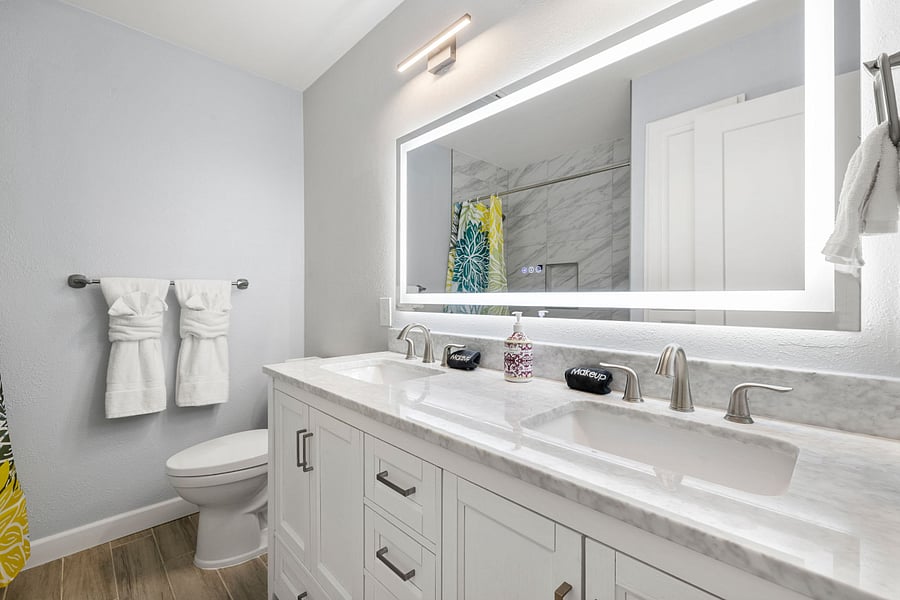 Spacious and stylish with double sinks, a bright LED mirror, and a full tub/shower combo.
